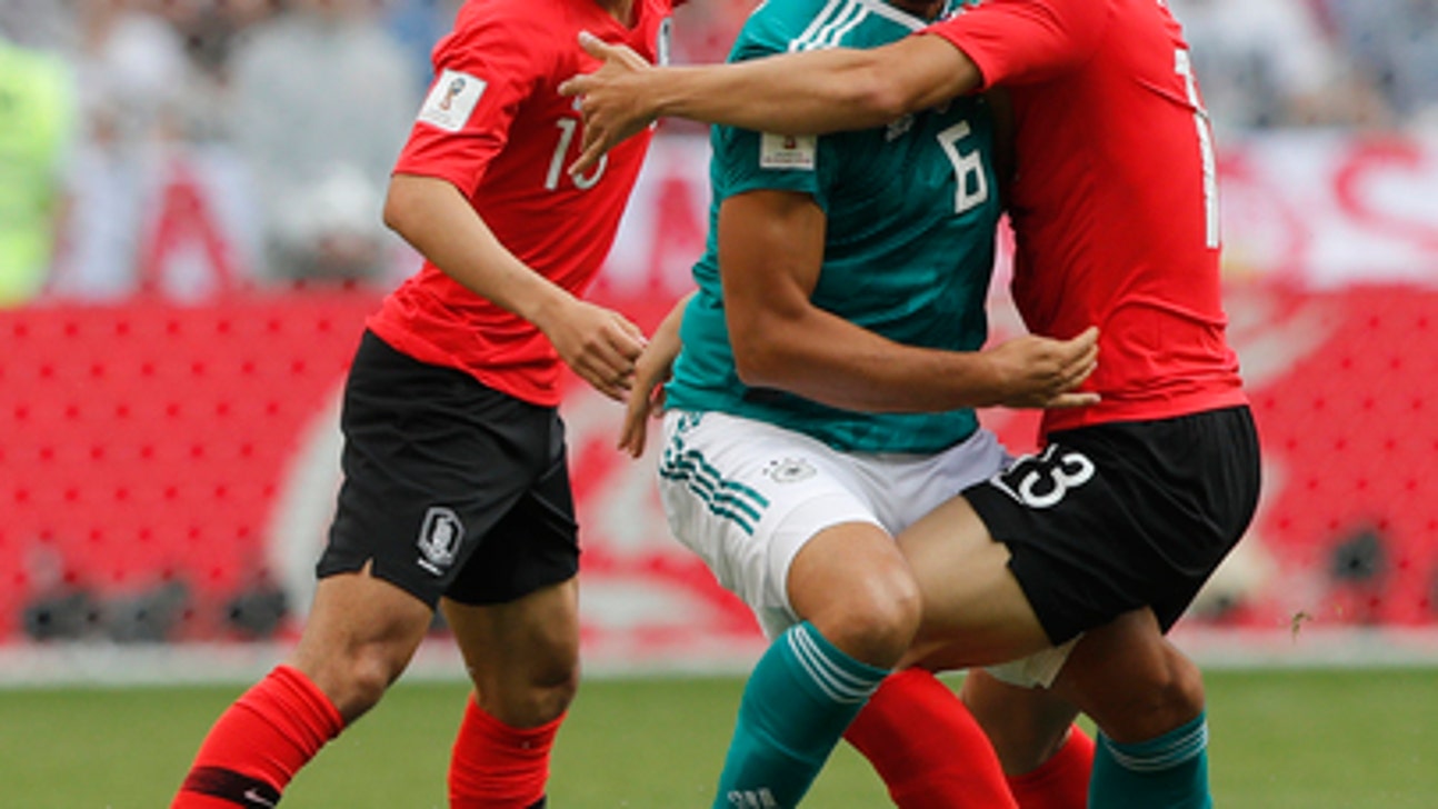 AP PHOTOS: Defending champs done after Day 14 at World Cup