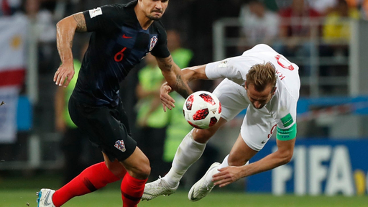 AP PHOTOS: Croatia’s resolve overcomes England’s youth