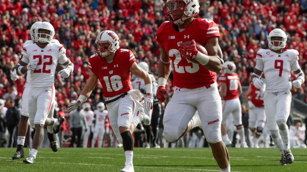 Wisconsin runs away from Rutgers 31-17, Taylor with 3 TDs
