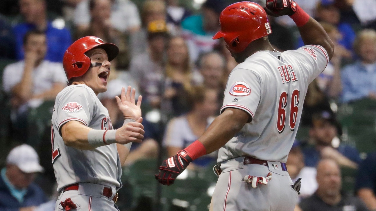 Reds withstand another homer by Yelich, beat Brewers 11-7