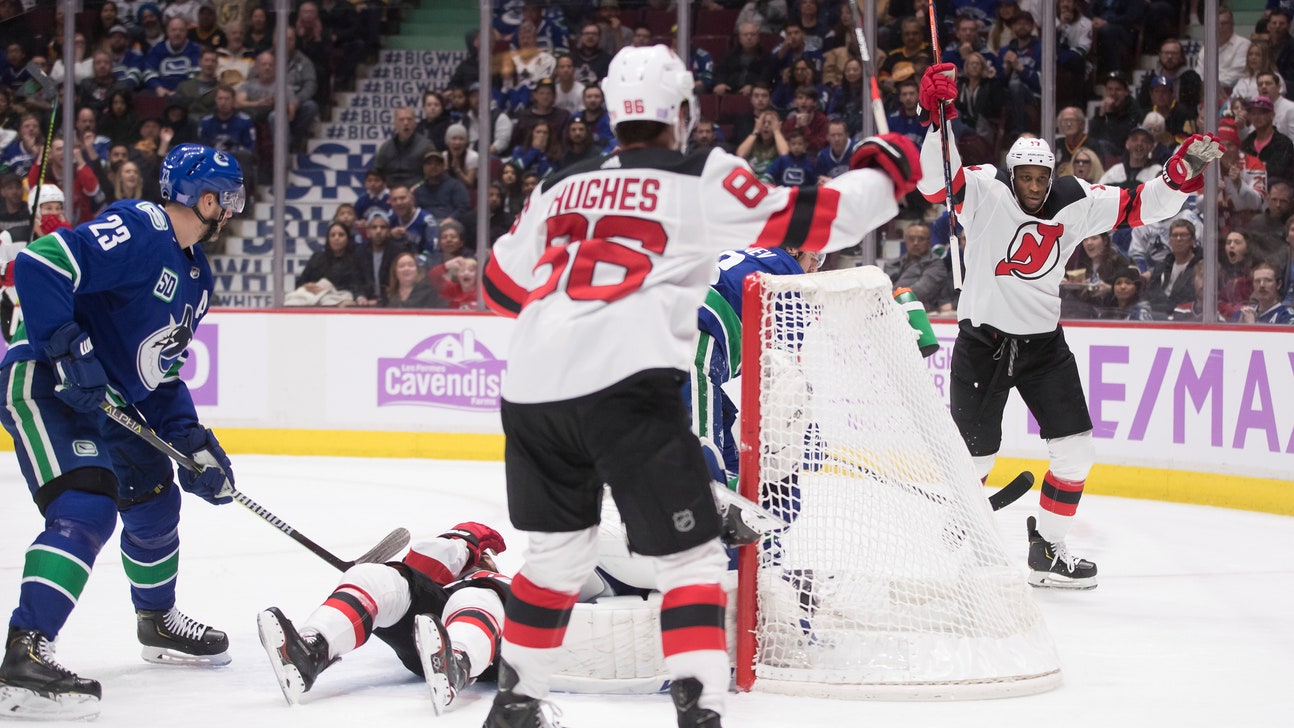 Devils score 2 quick goals, hold on to beat Canucks 2-1