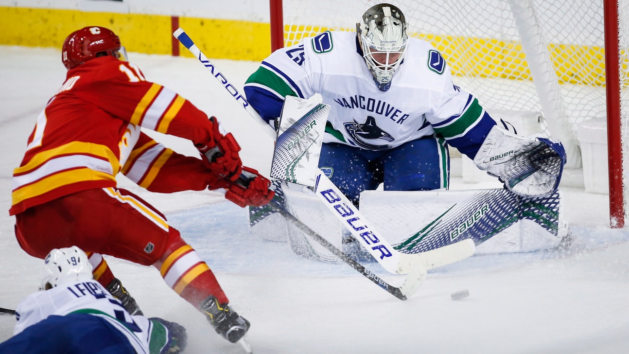 Lindholm scores twice, Flames beat Canucks 7-4