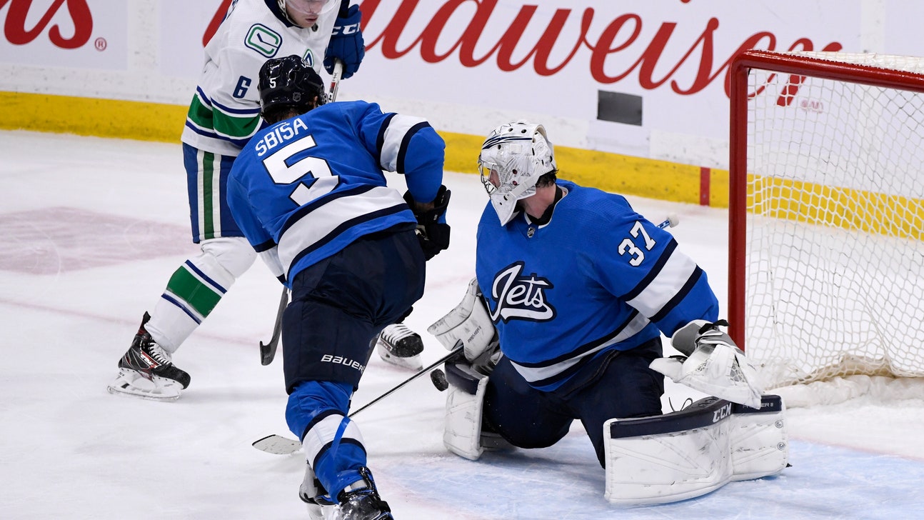 Hellebuyck's 41 saves leads Jets past Canucks 4-0