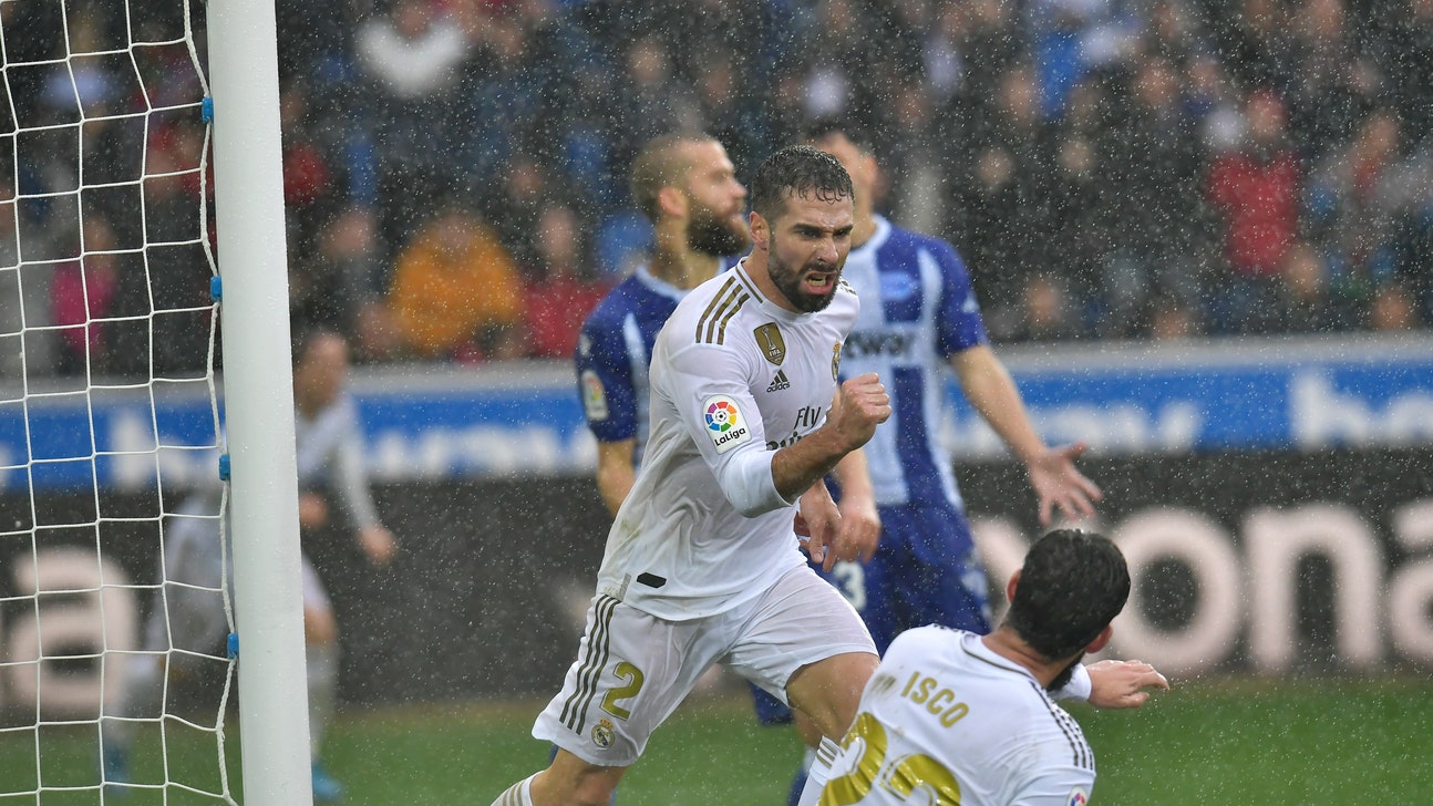 Real Madrid beats Alavés 2-1 to move ahead of Barcelona