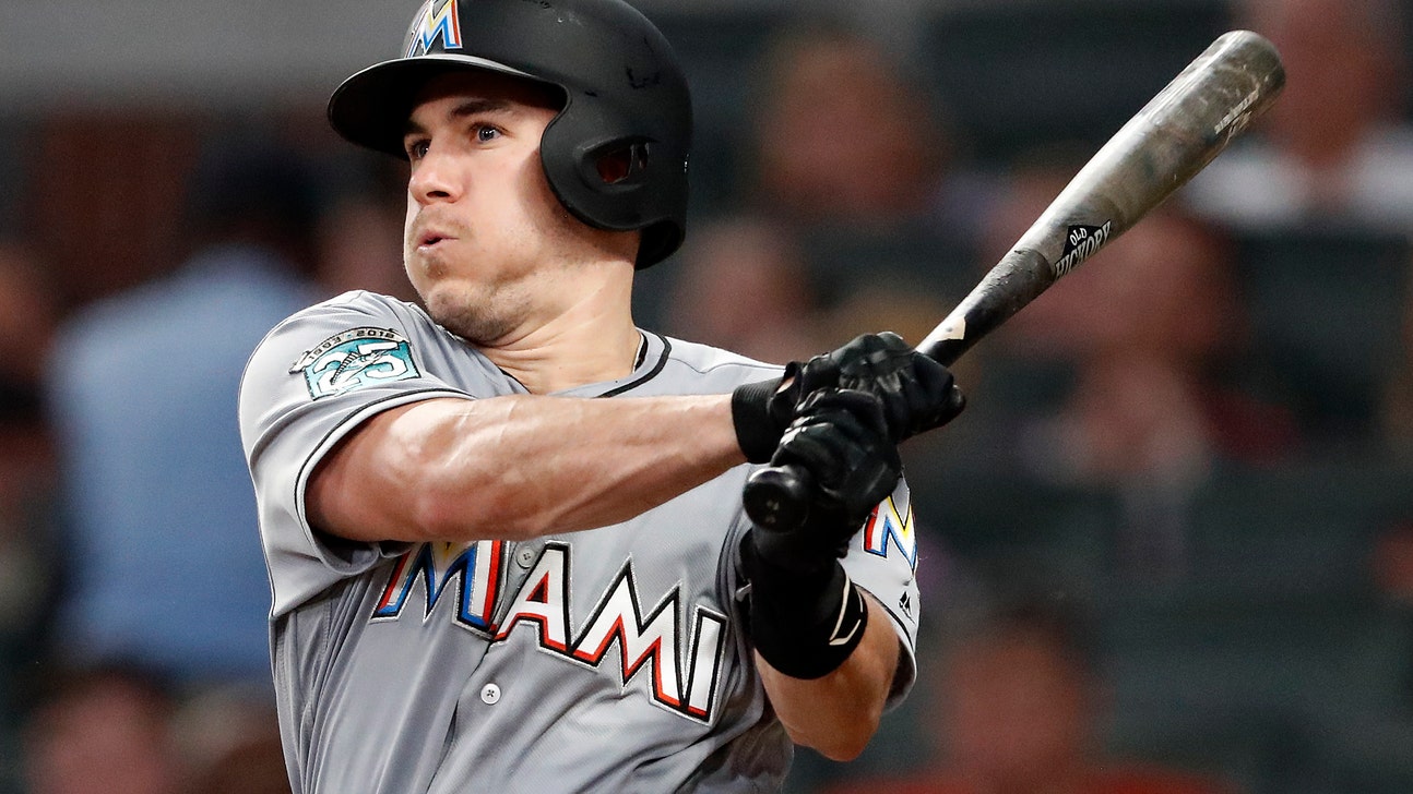 AP Source: Realmuto traded to Phillies for 3 players