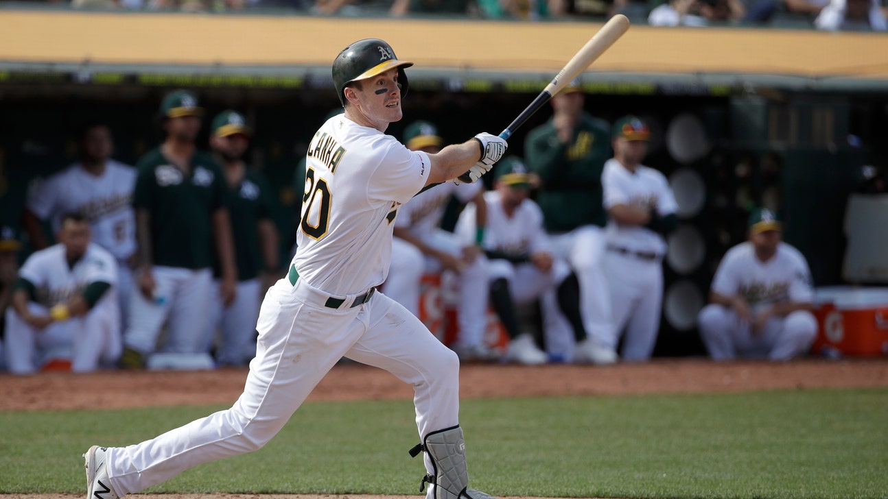 Canha hit in 11th, A's edge KC 1-0 to hold wild card lead