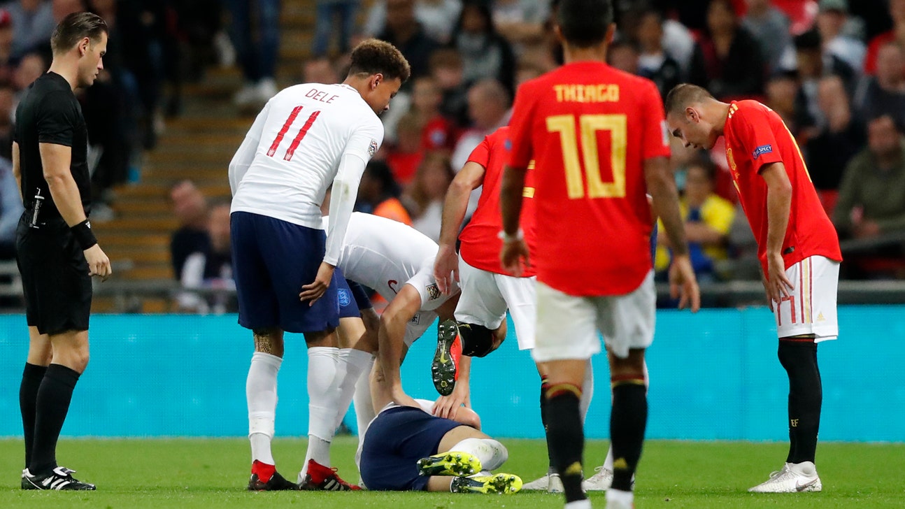 Shaw back at Man United after head knock on England duty