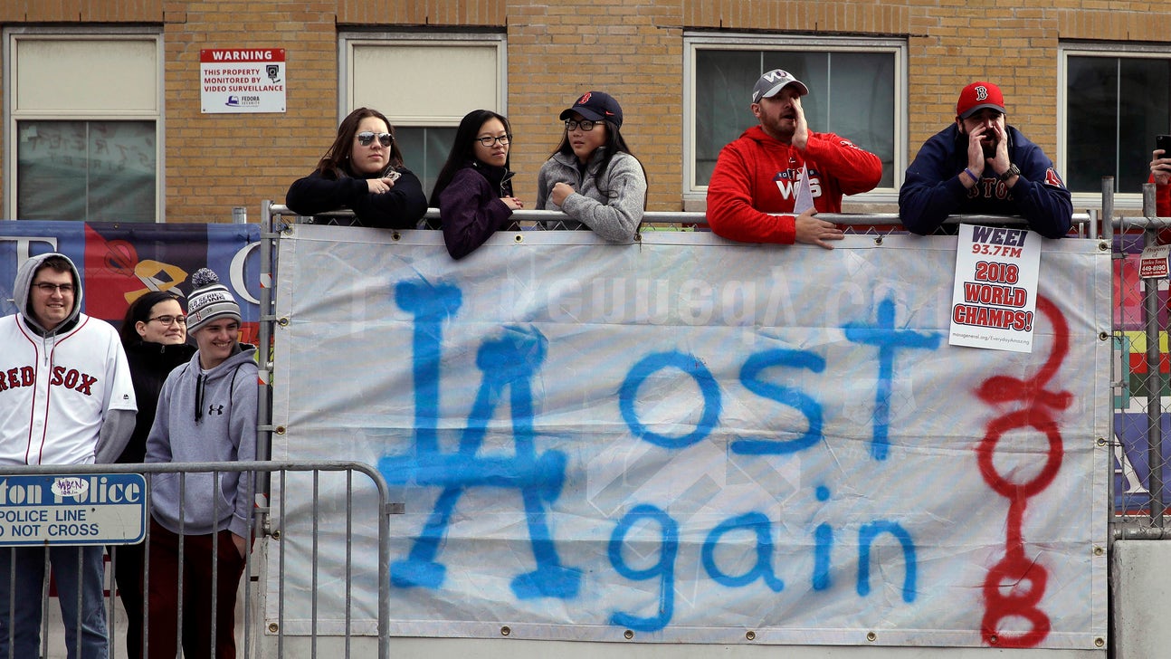 The Latest: Confetti and cheers as Boston celebrates Red Sox