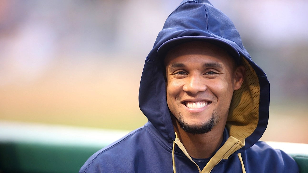 Giving mood: Brewers' Gomez gifts Reds' Hamilton bubblegum