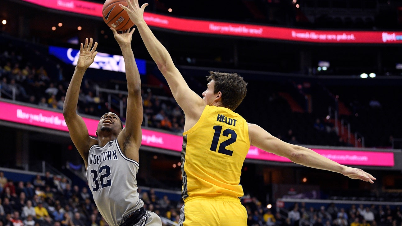No. 15 Marquette survives Georgetown despite Howard’s injury