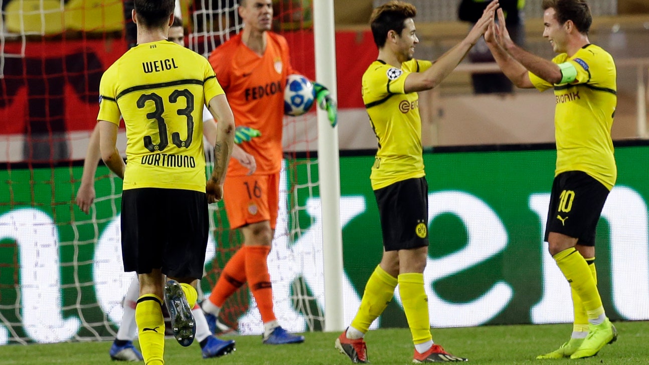 Dortmund secures top spot with 2-0 win at Monaco