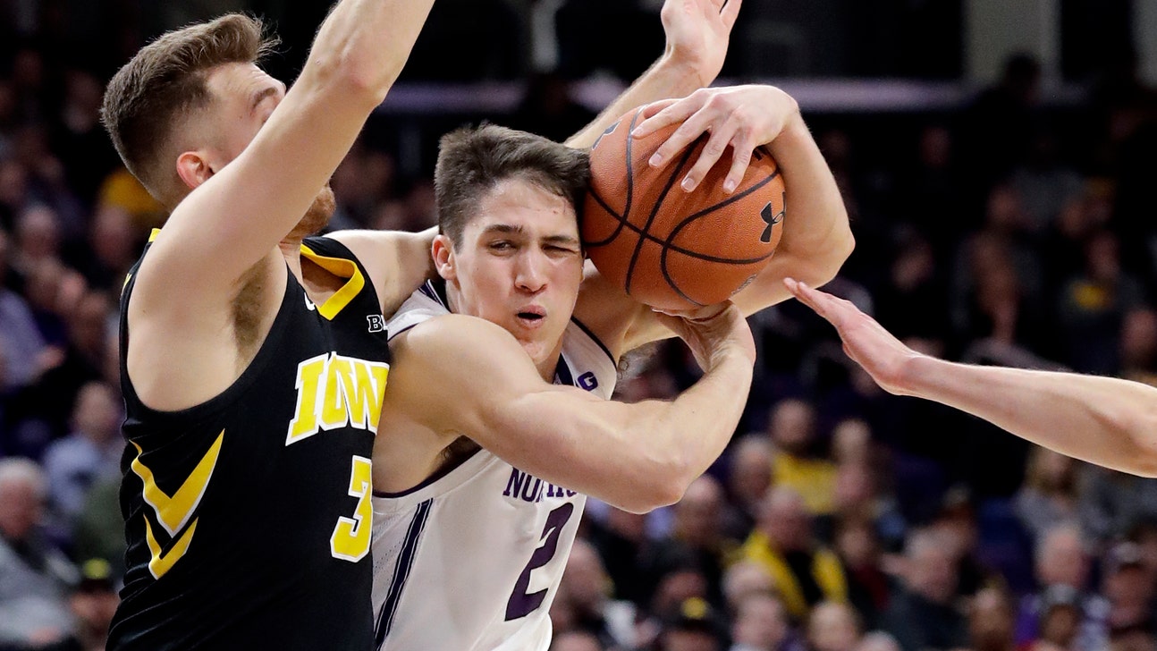 Weiskamp leads Iowa over Northwestern 73-63