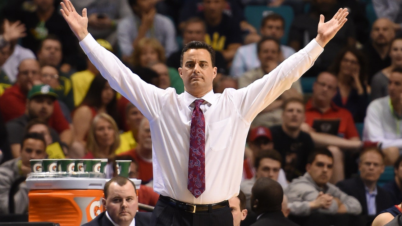 Arizona's Sean Miller is sweating so much you can see right through his shirt