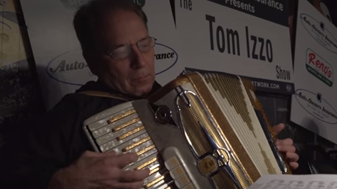 Merry Izz-mas!: Tom Izzo plays 'Jingle Bells' on accordion for radio show singalong