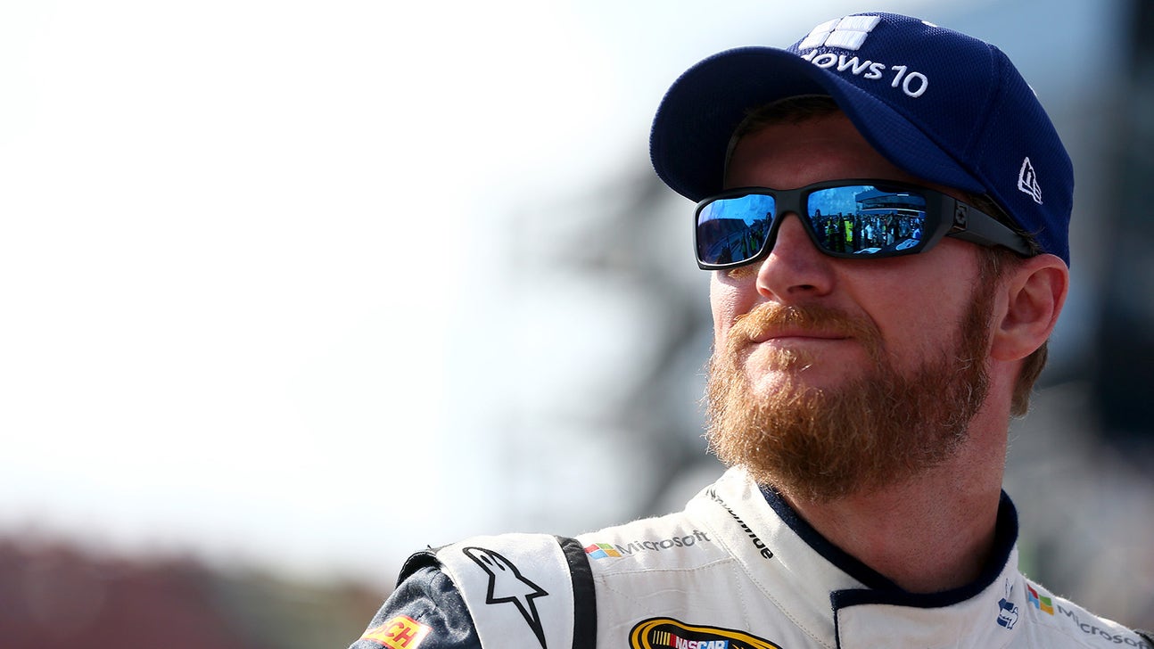 Dale Earnhardt Jr. tries on Dale Sr.'s 2001 IROC fire suit