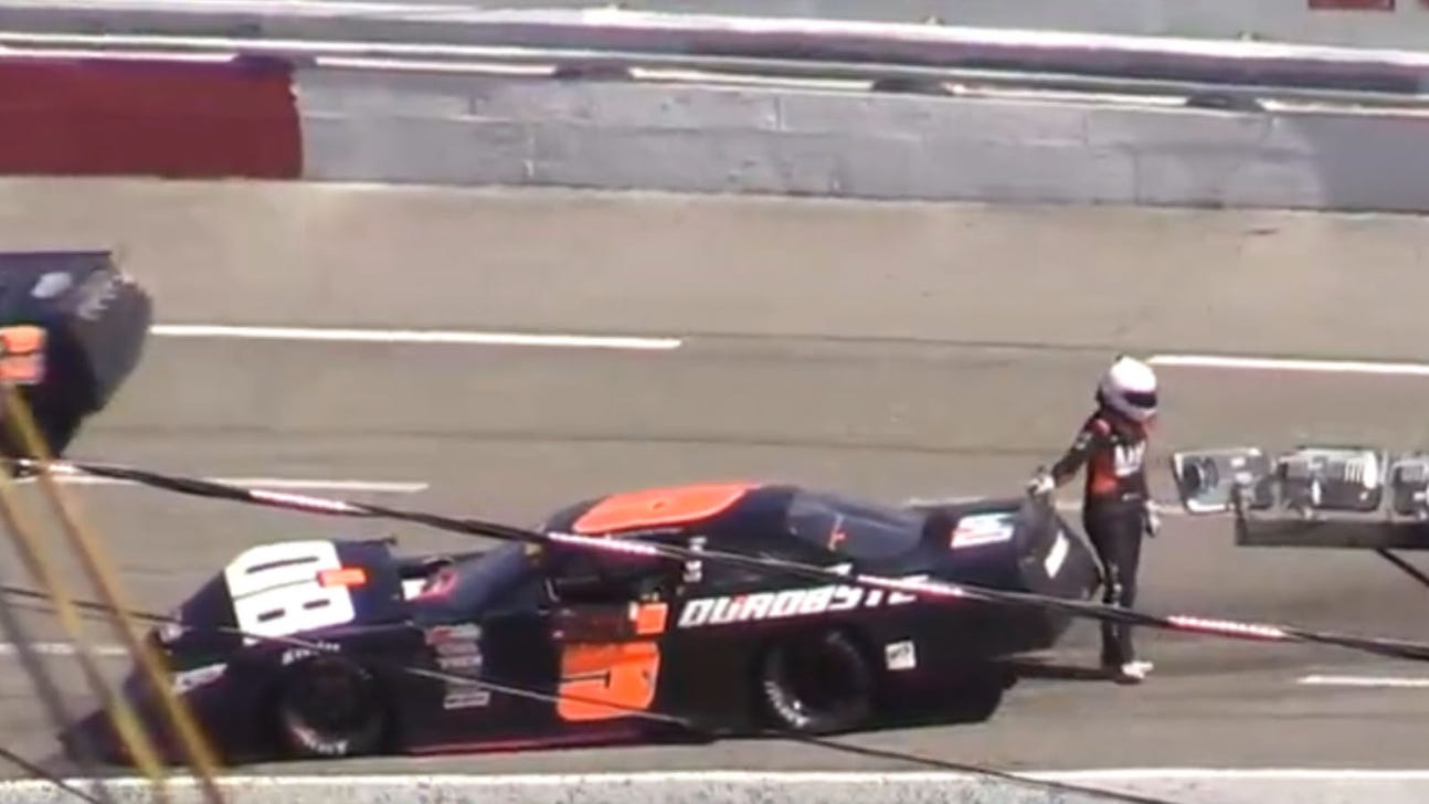 Take that! Driver kicks and punches her own car after wreck