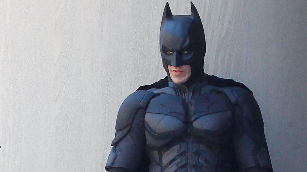 Local sports reporter takes swing at 'Batman' who videobombs live shot