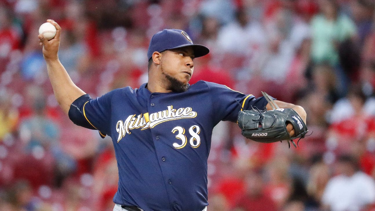 Peralta retires 15 straight for Brewers in shutout loss to Reds