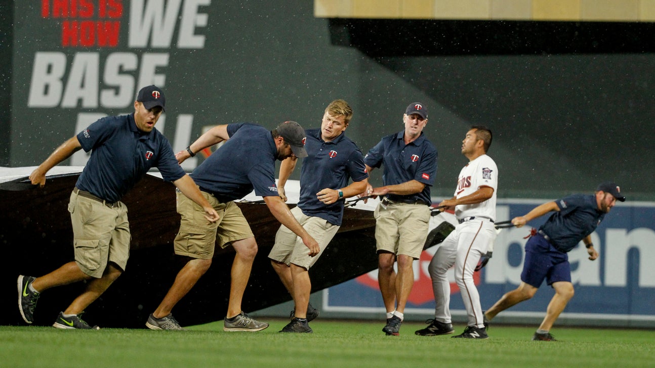 Twins wait through rain delays to beat Royals 6-4