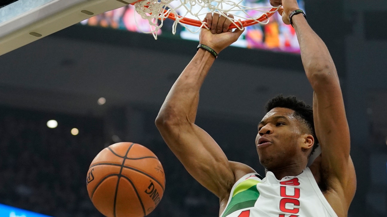 Giannis’ triple-double helps Bucks turn away Nets 129-115