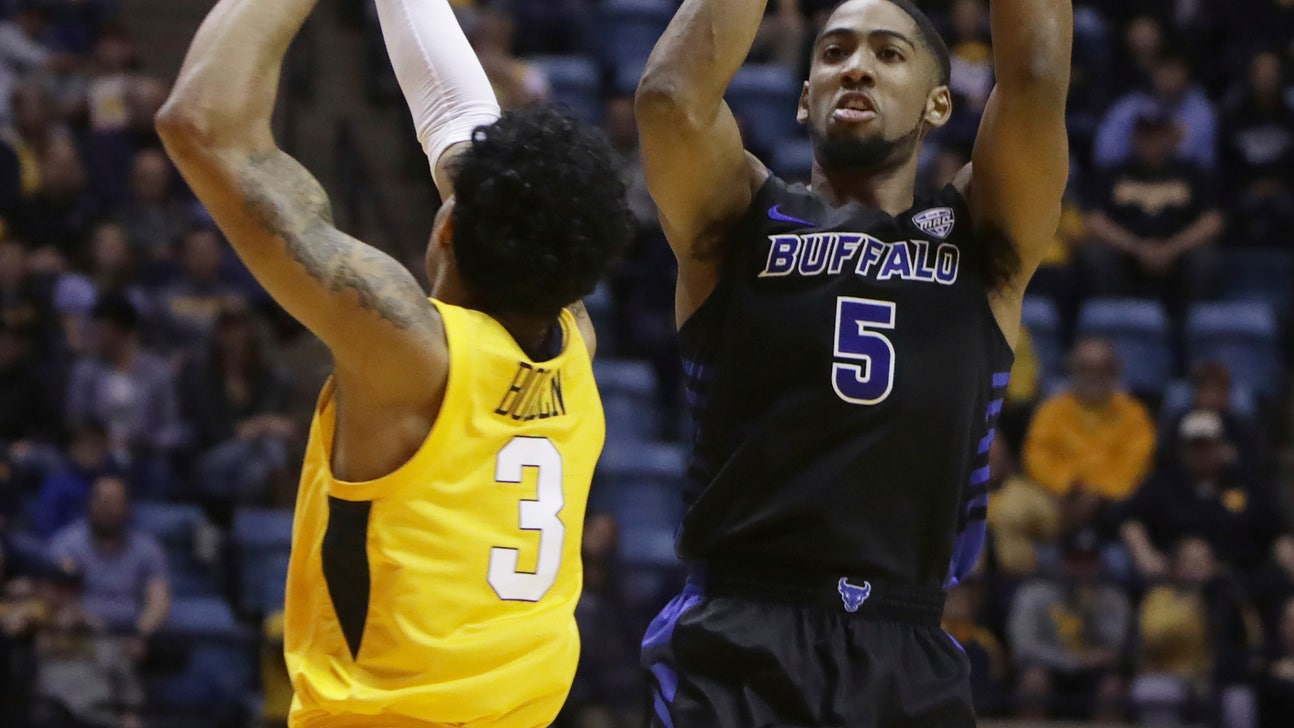 Massinburg scores 43, Buffalo stuns No. 13 WVU 99-94 in OT