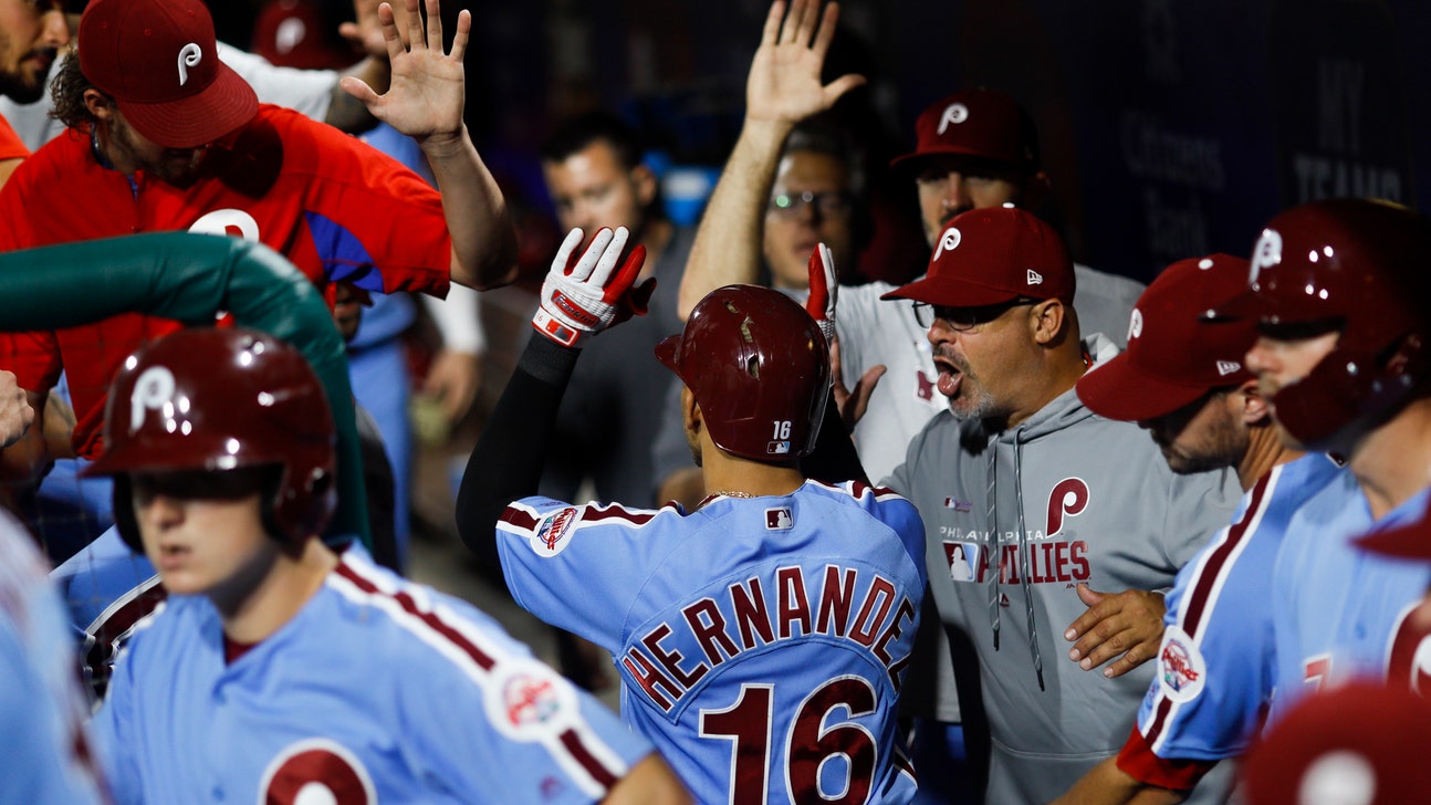 Hernandez helps lead Phillies past Braves