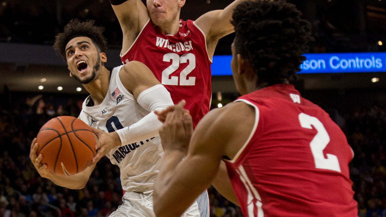Marquette beats No. 12 Wisconsin 74-69 in OT; Howard has 27
