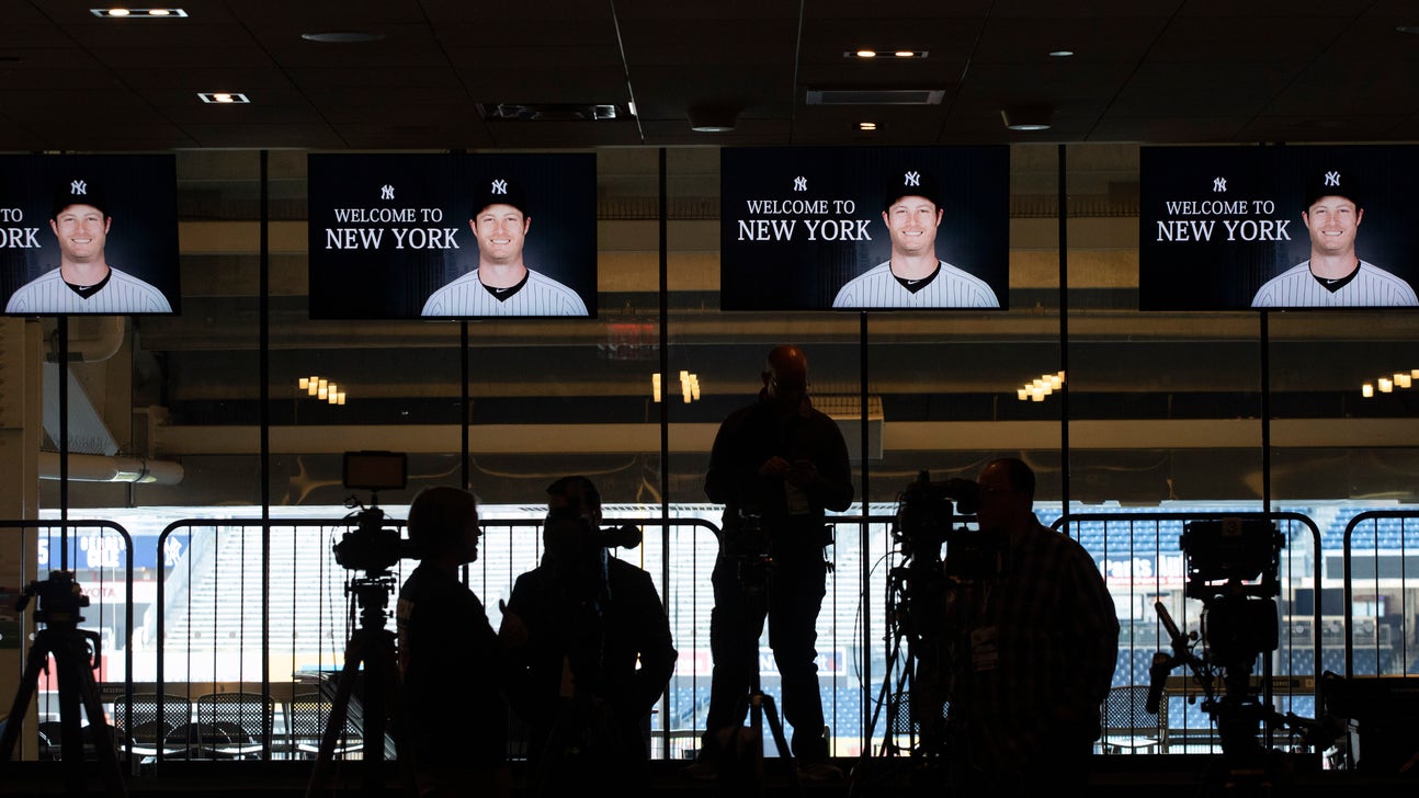 Future sign: Cole arrives with old placard of Yankees fealty