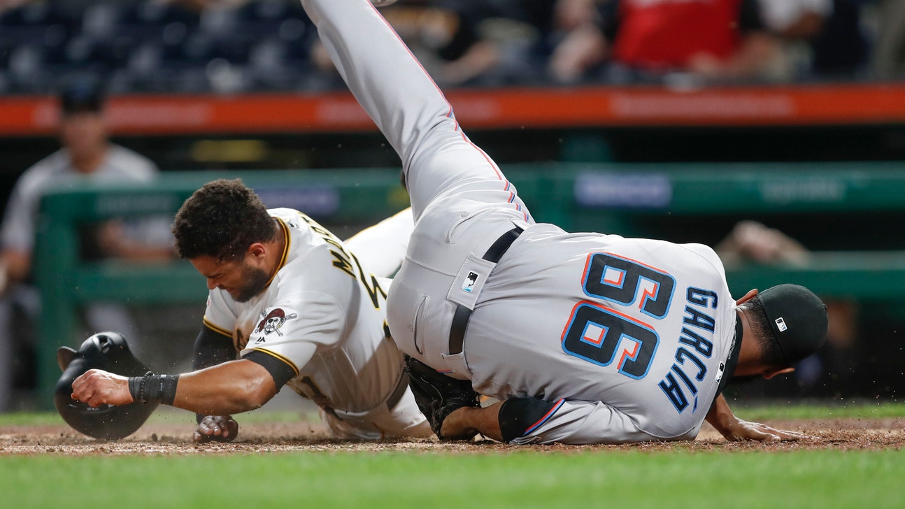 Rojas, Cooper late homers help Marlins end record road skid