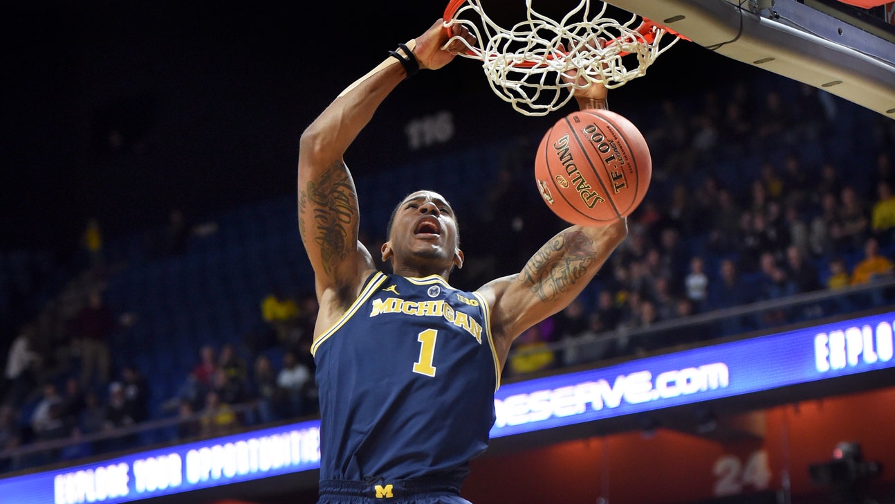 The Latest: No. 18 Michigan routs GW in Tip-Off tournament