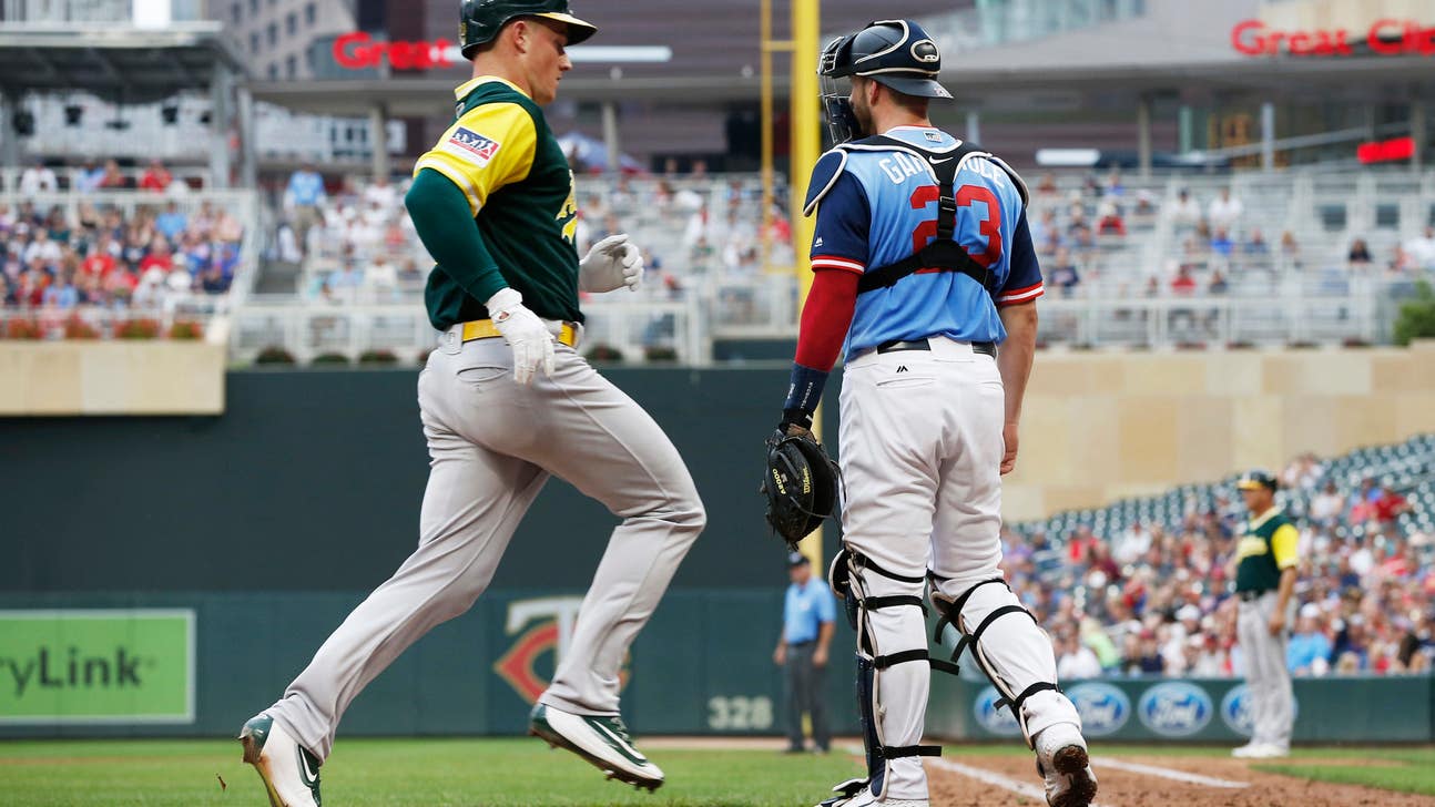 Chapman, Lowrie power A’s past Twins, 6-2