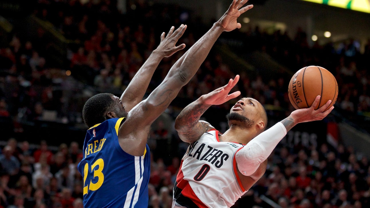 Lillard says he has separated ribs, will play through pain