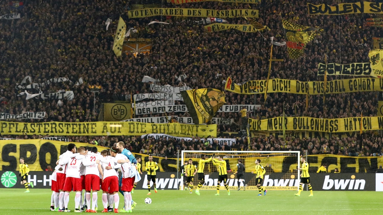 Tensions overflow from stands onto the field in Dortmund's win vs. RB Leipzig