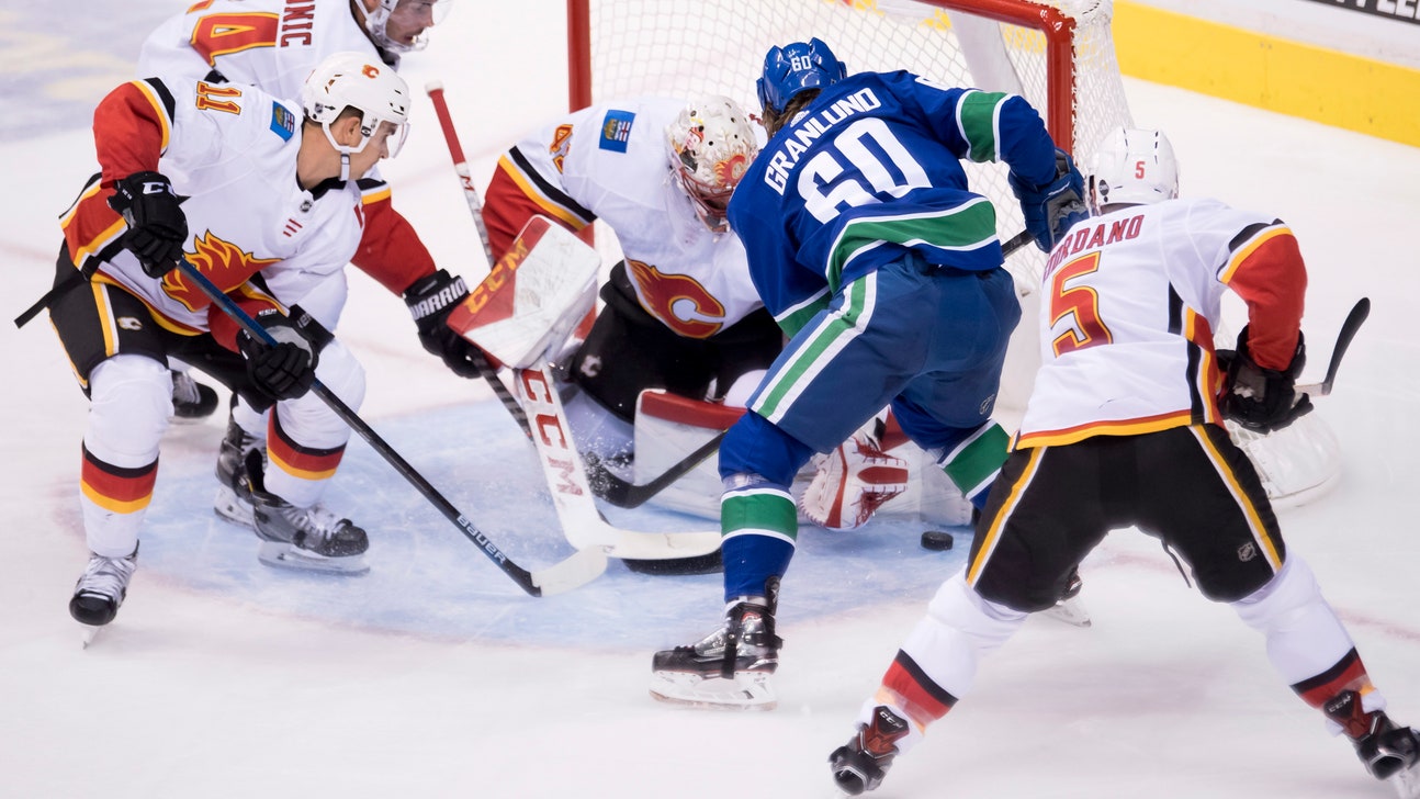 Pettersson scores 1st goal, Canucks beat Flames 5-2