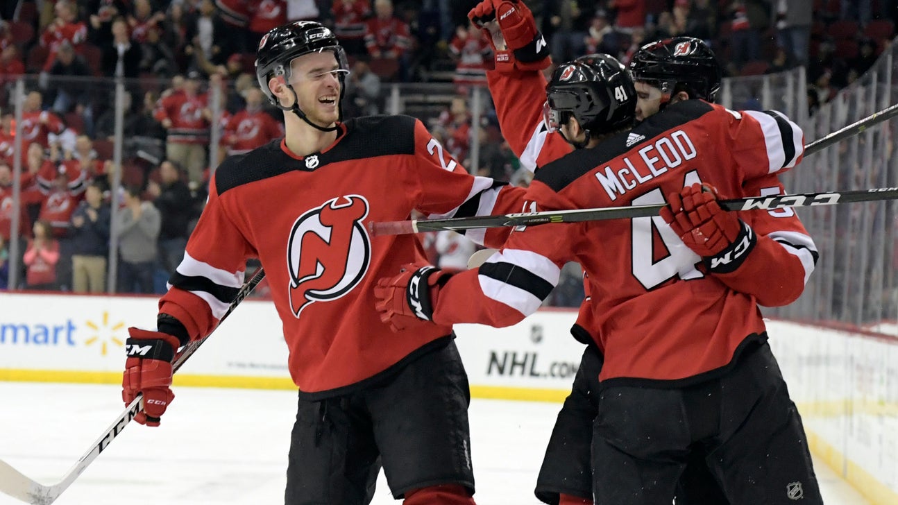 Devils D Mirco Mueller taken off ice on stretcher