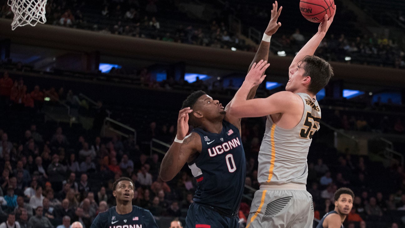 The Latest: Iowa beats UConn for 2K Classic title