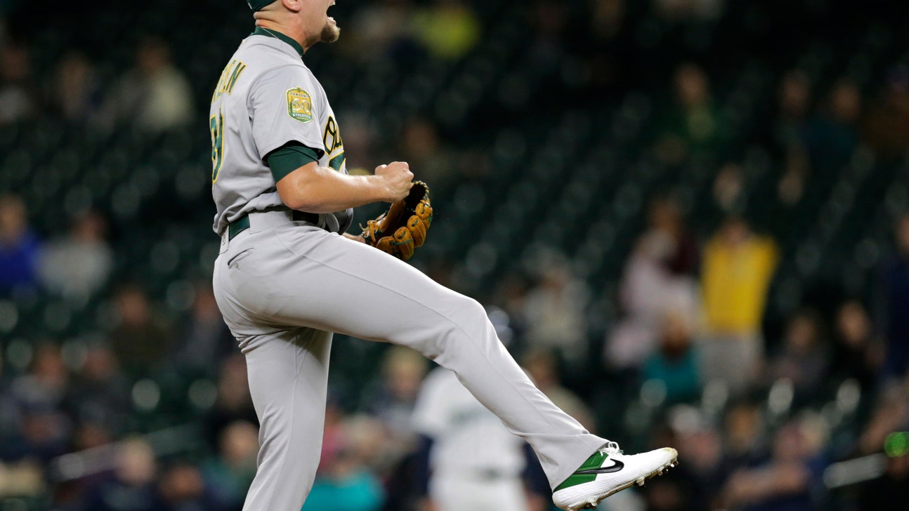 A’s clinch playoff berth, then beat Mariners 7-3