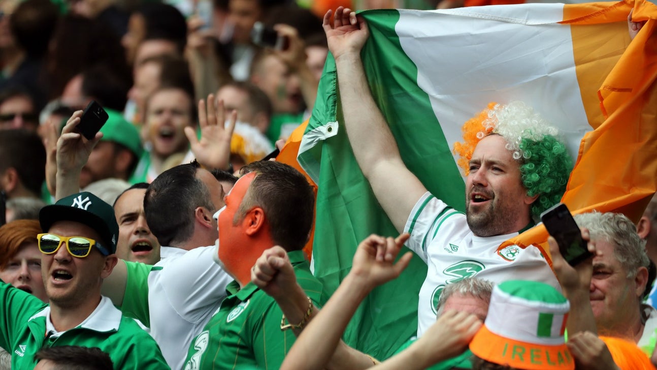 Ireland fans sing "clean up for the boys in green" while cleaning town square at Euros