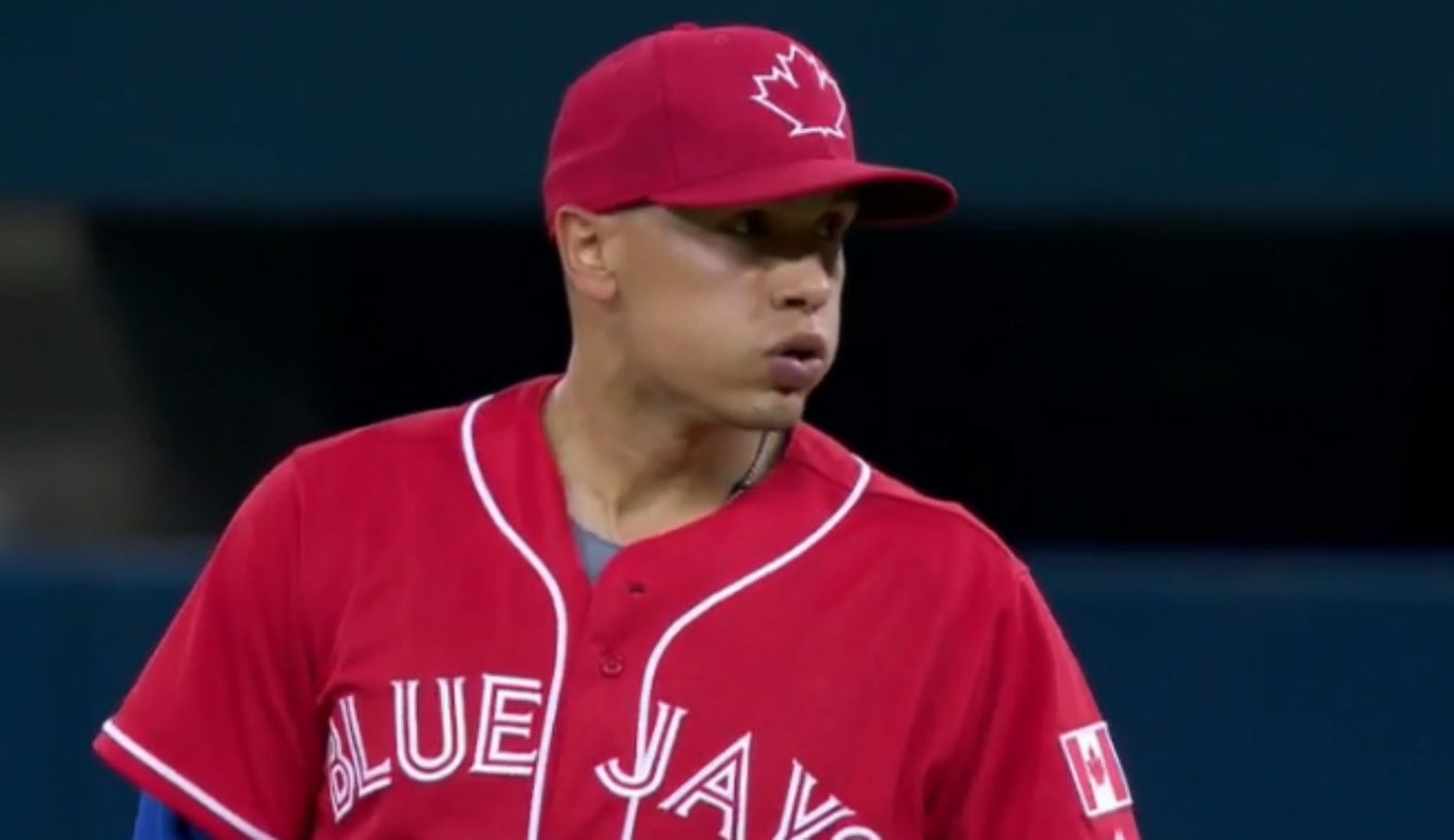 Blue Jays 2B Ryan Goins throws perhaps the worst warm-up pitch ever