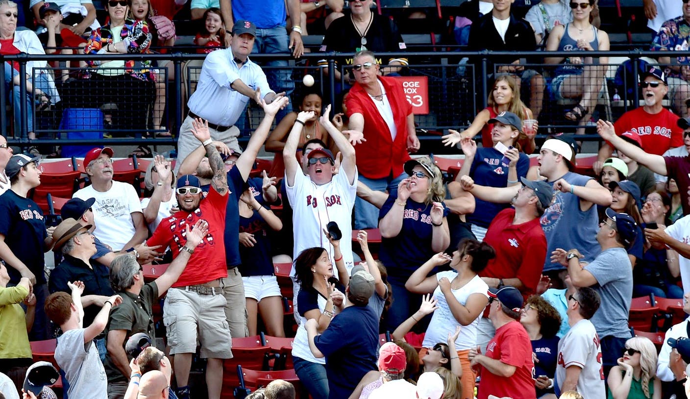 Young Red Sox fan gives ball to girl behind him