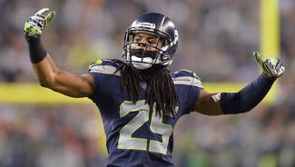 Next Story Image: Richard Sherman hands out Beats By Dre headphones to teammates
