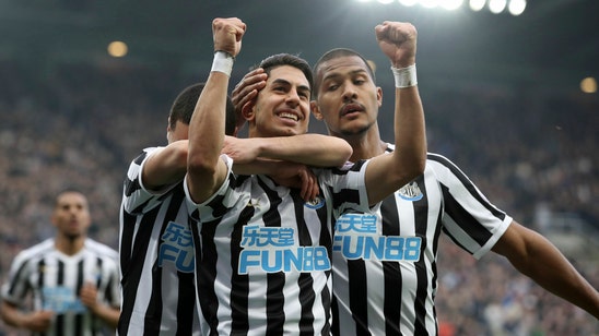 Newcastle beats 10-man Huddersfield 2-0 in Premier League