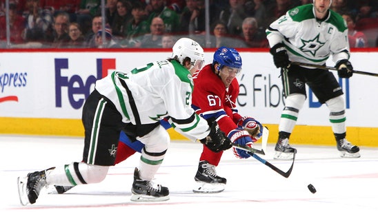 Stars fall on the road to Canadiens in overtime