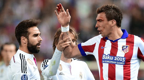 Atletico's Mandzukic gets bitten and battered in Madrid derby