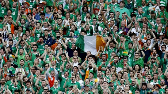 Throng of Irish fans serenades random man on a balcony in Paris