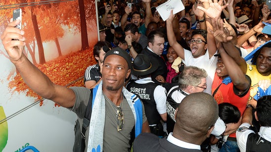 Didier Drogba mobbed by fans at Montreal airport