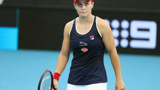 Top-ranked Barty overcomes late collapse to win at Adelaide