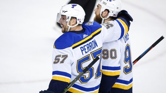 Perron scores in OT to lift Blues past Flames 3-2