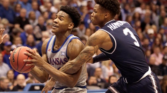 Moss leads No. 5 Kansas to 112-57 romp over Monmouth
