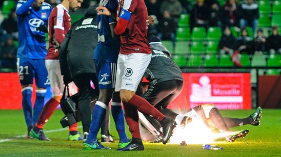 Lyon goalkeeper taken to hospital after fans throw firecrackers at him